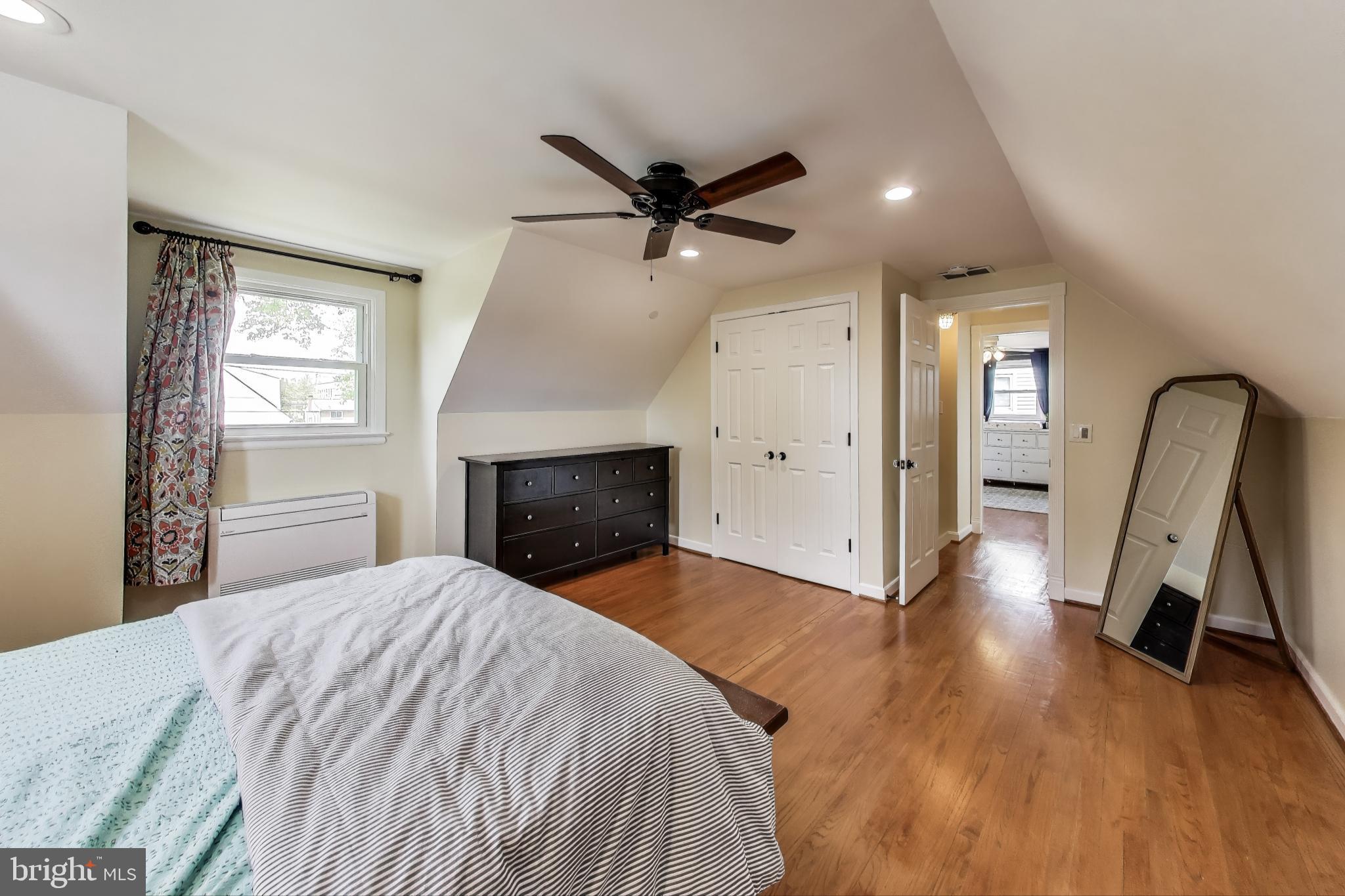 3316 Harrell Street Silver Spring, MD 20906 - Photo 18 of 38 a view of a livingroom with a fireplace a ceiling fan and wooden floor