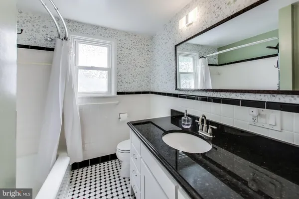 a bathroom with a sink double vanity and a mirror