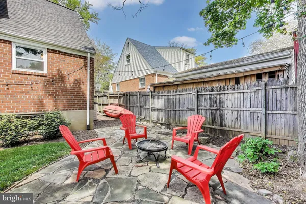 a view of a chairs setting in front of a house