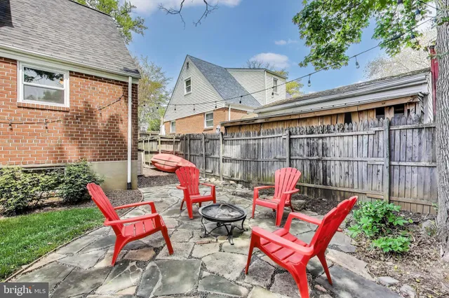 a view of a chairs setting in front of a house