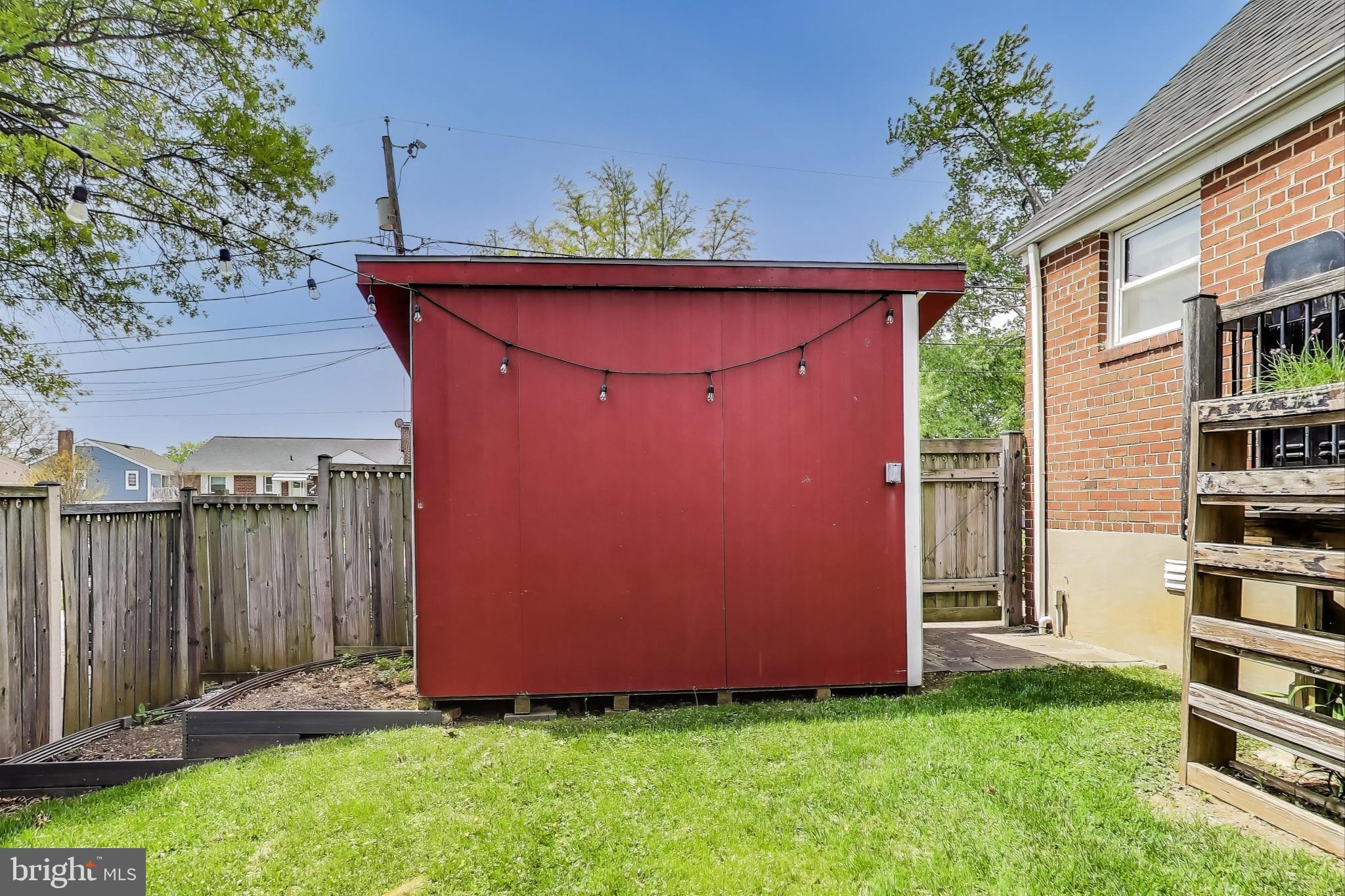 3316 Harrell Street Silver Spring, MD 20906 - Photo 35 of 38 a backyard of a house with table and chairs