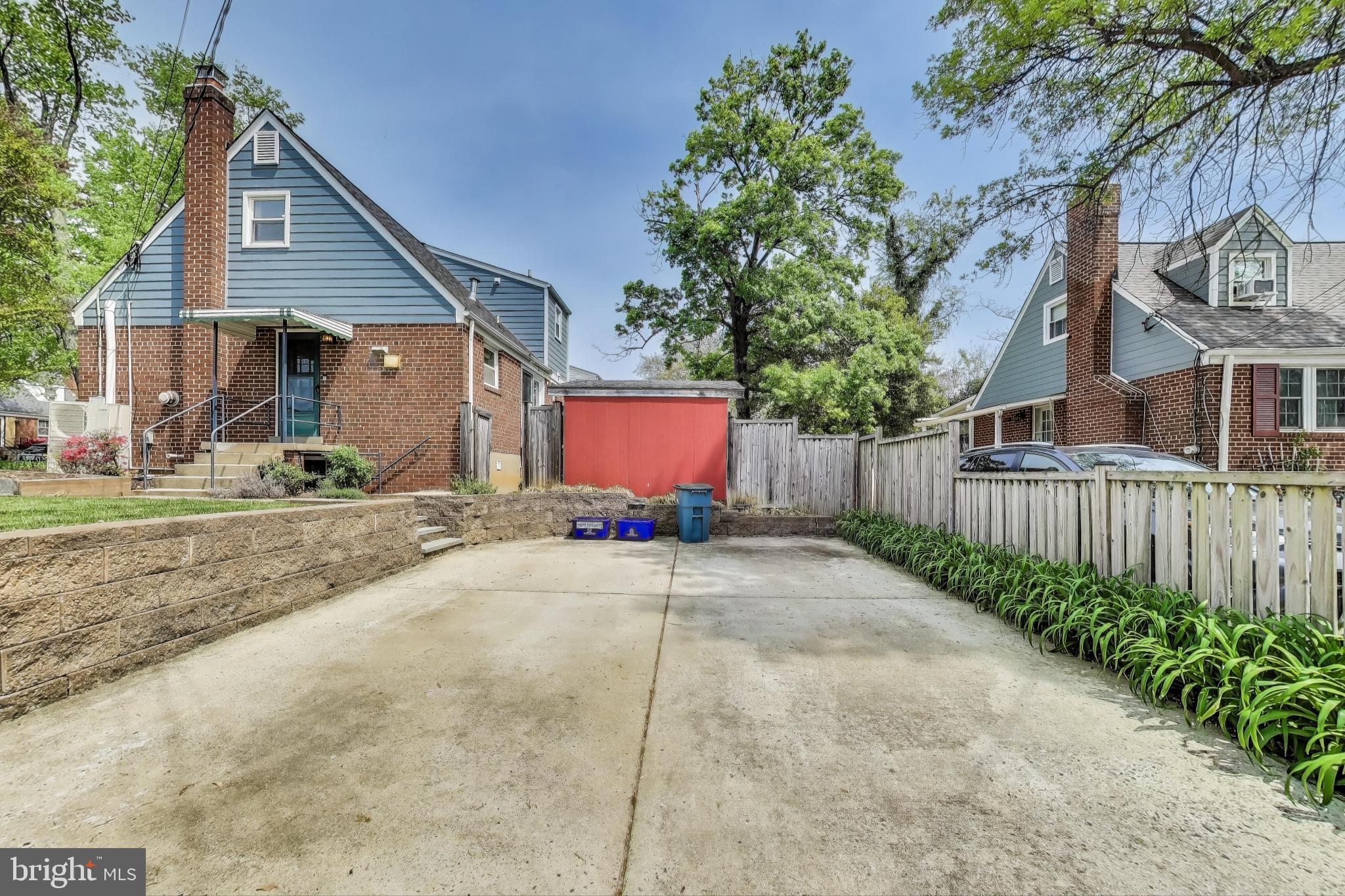 3316 Harrell Street Silver Spring, MD 20906 - Photo 36 of 38 a view of a house with a yard and tree s