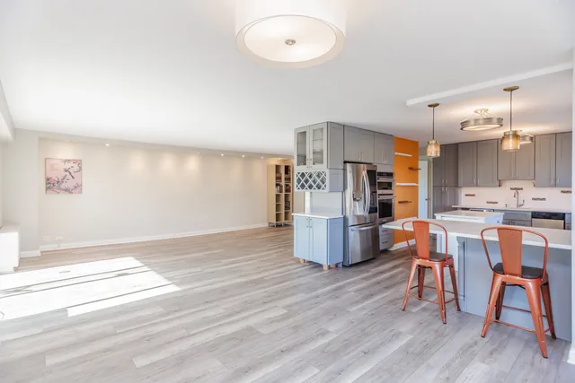a kitchen with a stove oven and sink