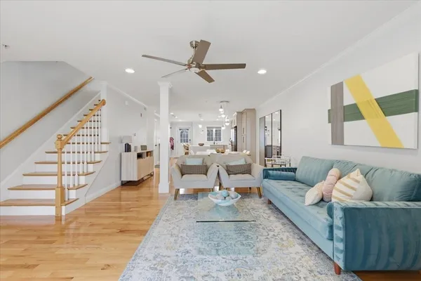 a living room with furniture and a rug