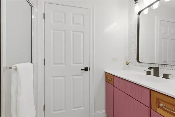 a bathroom with a sink and a mirror