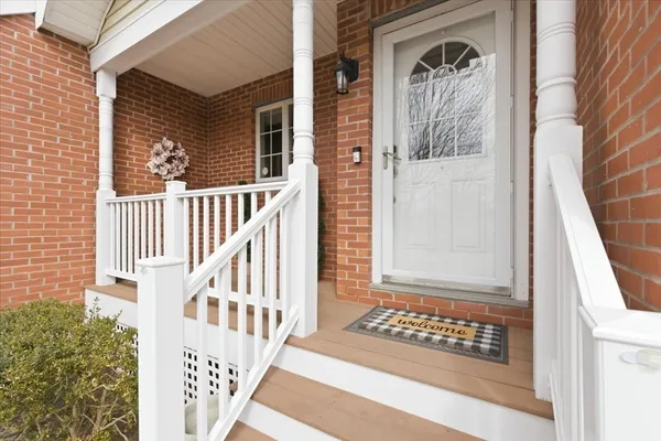 a view of a door with a door and wooden floor