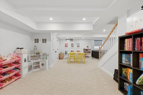 a view of a livingroom with furniture and toys