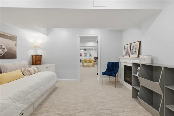 a bedroom with a bed and chair