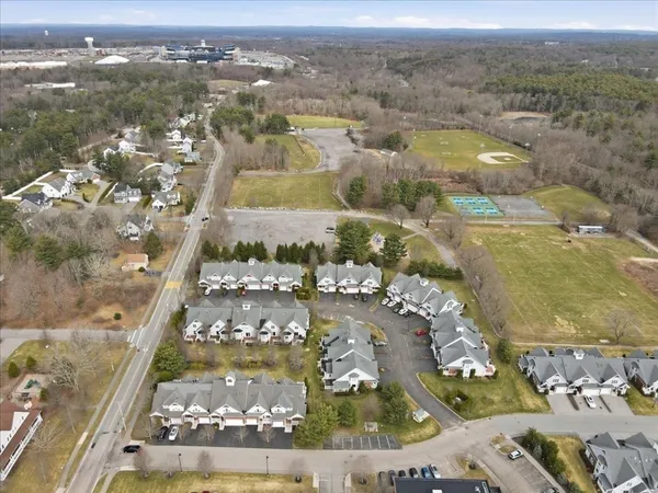 an aerial view of residential houses with outdoor space