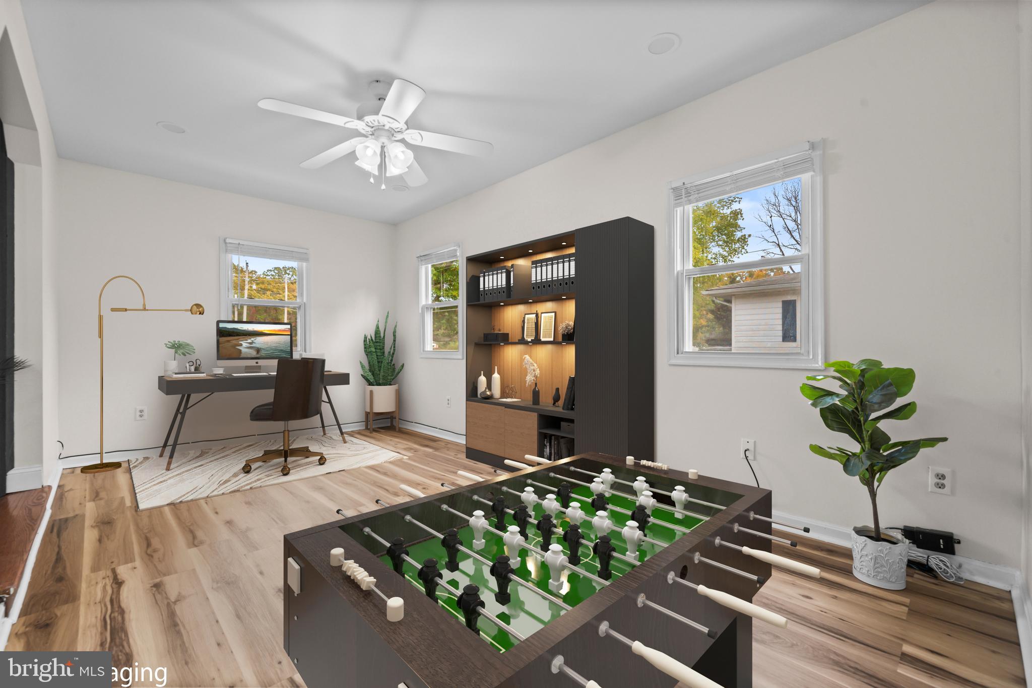 16203 Brandywine Road Brandywine, MD 20613 - Photo 15 of 37 a living room with furniture and a flat screen tv