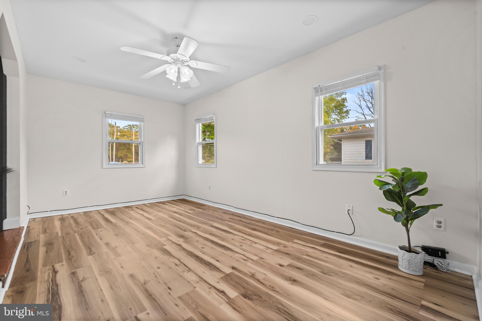 16203 Brandywine Road Brandywine, MD 20613 - Photo 16 of 37 a view of an entryway with wooden floor and a ceiling fan