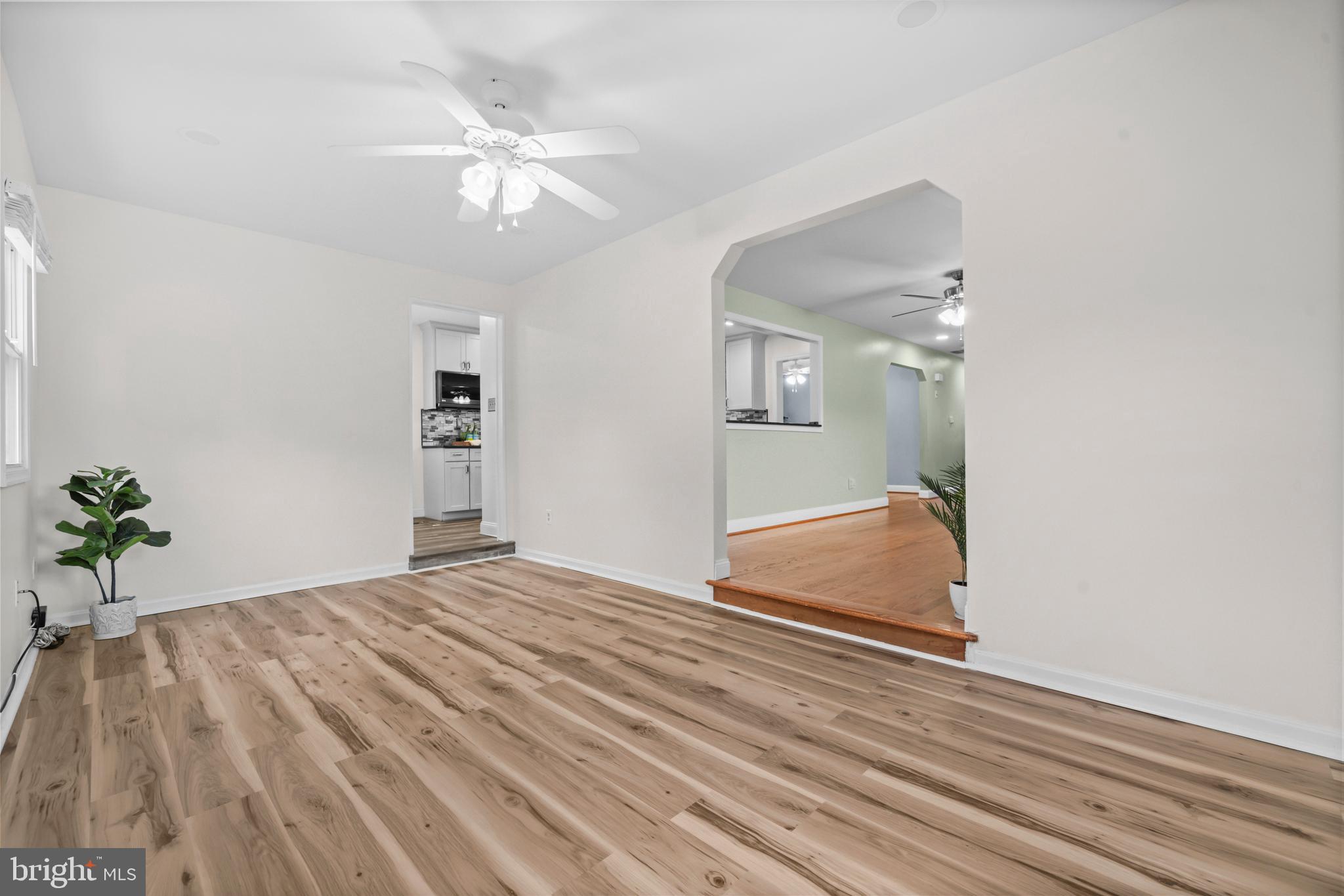 16203 Brandywine Road Brandywine, MD 20613 - Photo 17 of 37 an empty room with wooden floor and fan