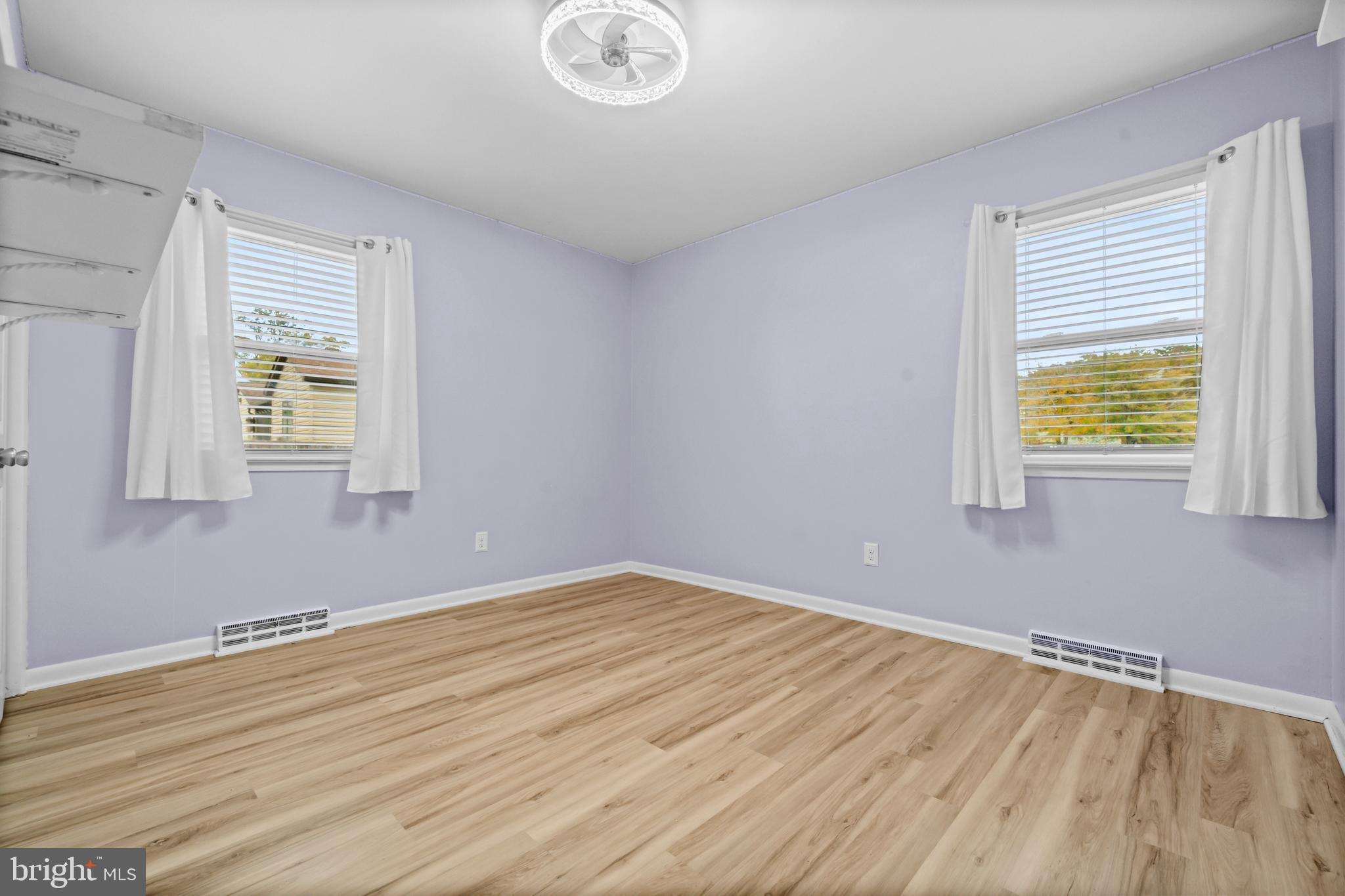 16203 Brandywine Road Brandywine, MD 20613 - Photo 24 of 37 a view of an empty room with wooden floor and a window