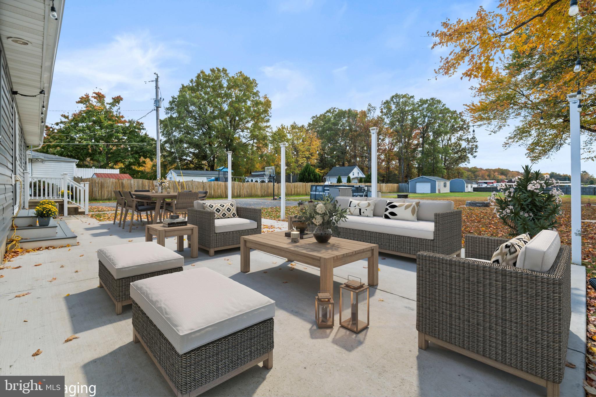 16203 Brandywine Road Brandywine, MD 20613 - Photo 30 of 37 a view of a patio with couches and a fire pit and a yard