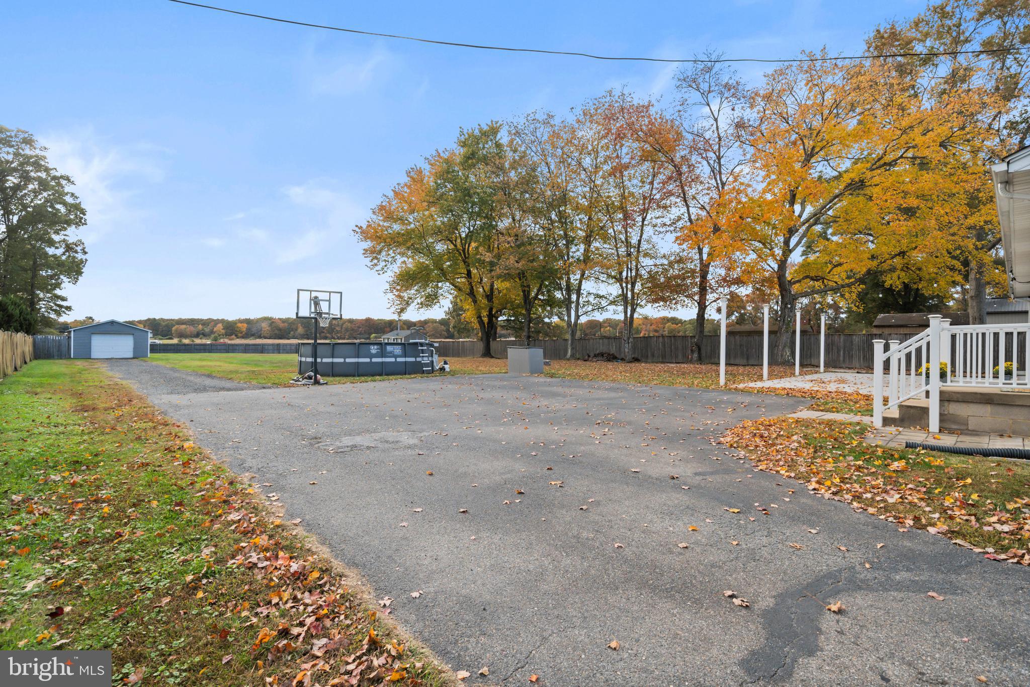 16203 Brandywine Road Brandywine, MD 20613 - Photo 34 of 37 a view of a street with a bench and trees around