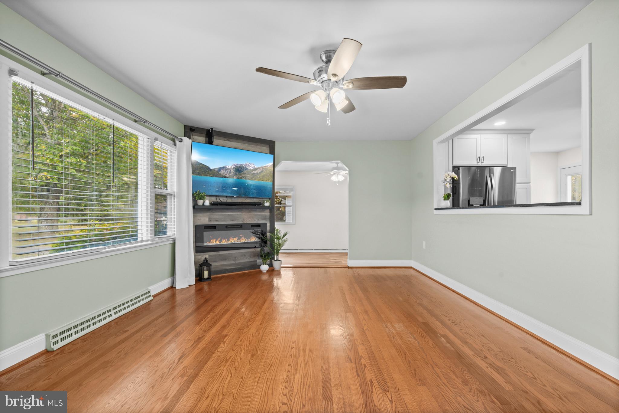 16203 Brandywine Road Brandywine, MD 20613 - Photo 9 of 37 a view of an empty room with a window and wooden floor