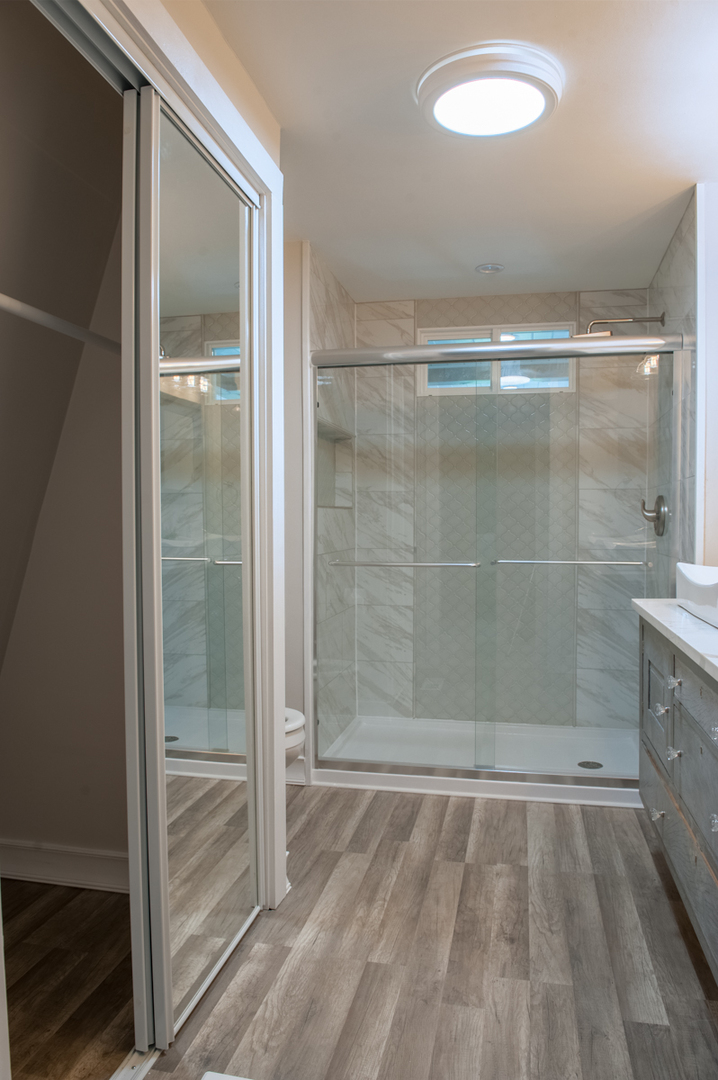 24843 Emerson Road Sterling, IL 61081 - Photo 22 of 34 a bathroom with a glass shower door