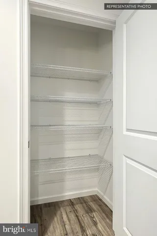 a view of an empty room with a fireplace