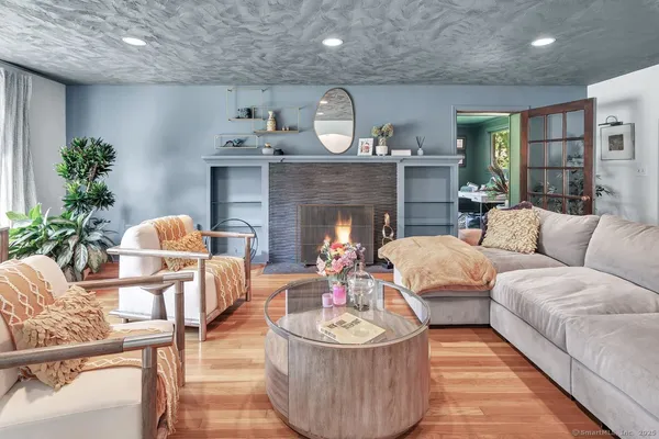 a living room with furniture and a fireplace