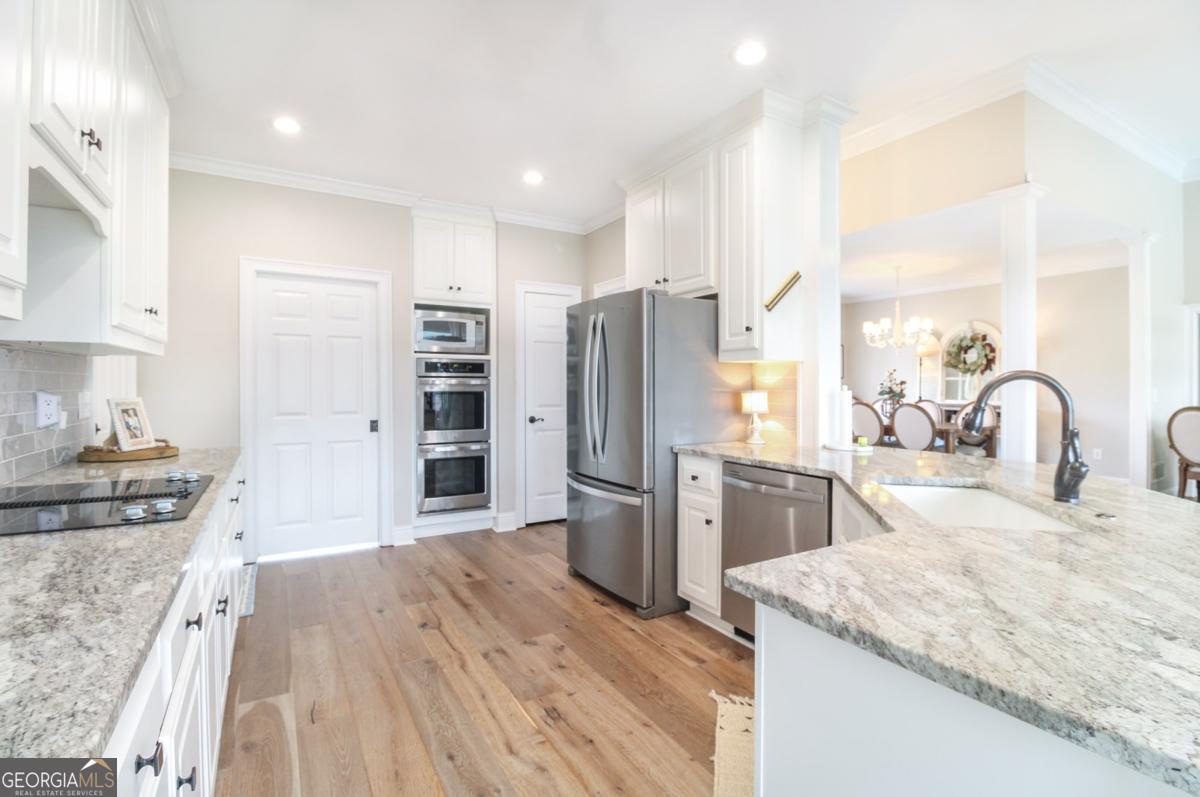 1380 Sunset Ridge Watkinsville, GA 30677 - Photo 11 of 74 a kitchen with refrigerator and cabinets