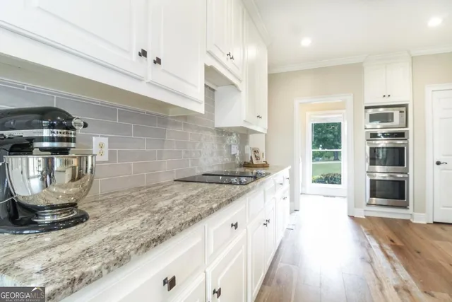 a kitchen with a stove and a sink