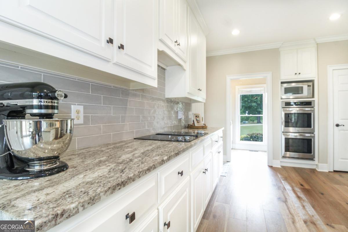 1380 Sunset Ridge Watkinsville, GA 30677 - Photo 13 of 74 a kitchen with a stove and a sink