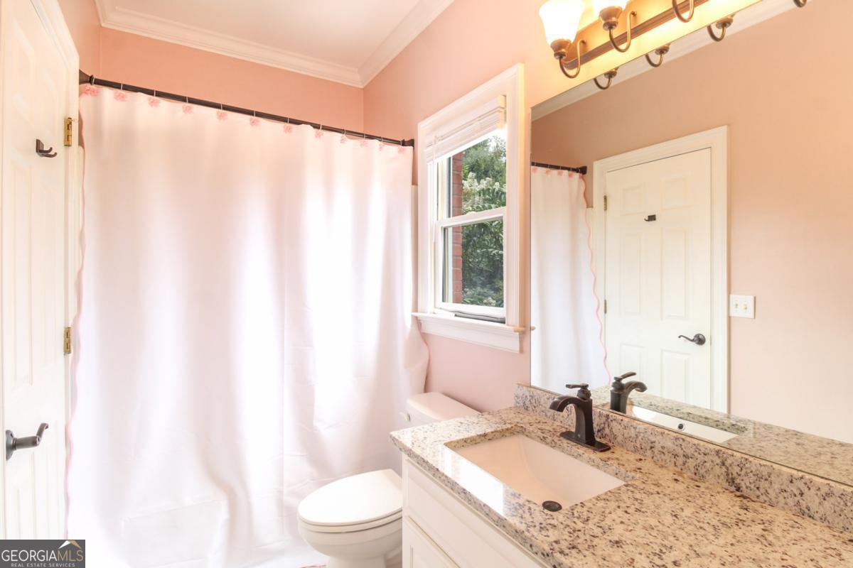 1380 Sunset Ridge Watkinsville, GA 30677 - Photo 20 of 74 a bathroom with a granite countertop sink toilet and shower