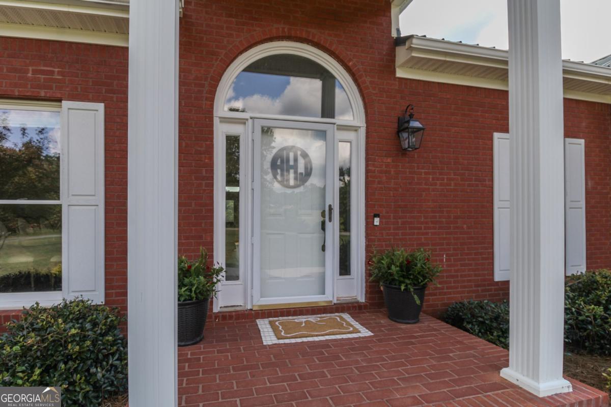 1380 Sunset Ridge Watkinsville, GA 30677 - Photo 2 of 74 a front view of a house with garden