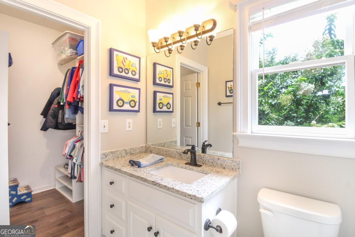 1380 Sunset Ridge Watkinsville, GA 30677 - Photo 23 of 74 a bathroom with a granite countertop sink and a mirror
