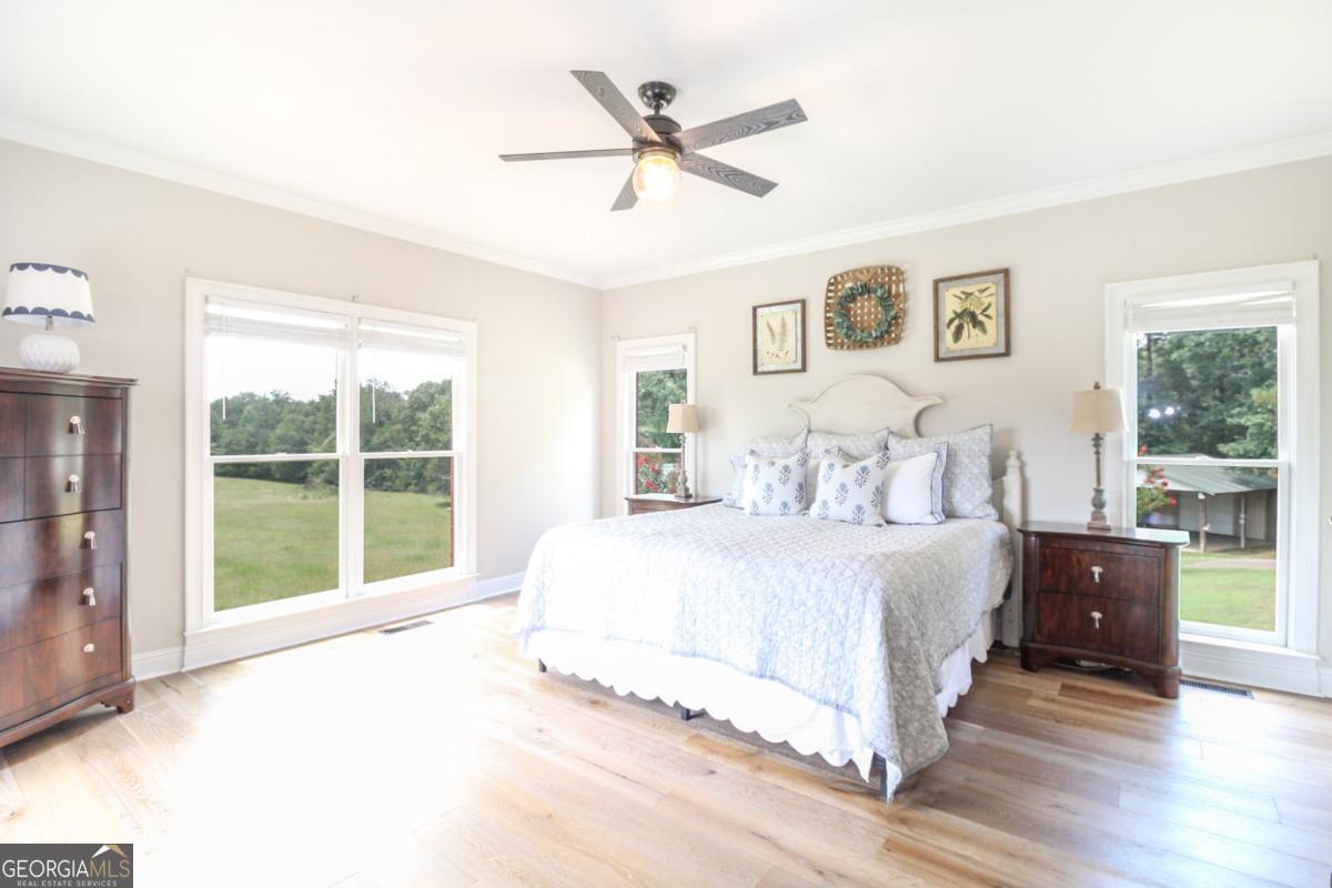 1380 Sunset Ridge Watkinsville, GA 30677 - Photo 25 of 74 a spacious bedroom with a large bed and a large window