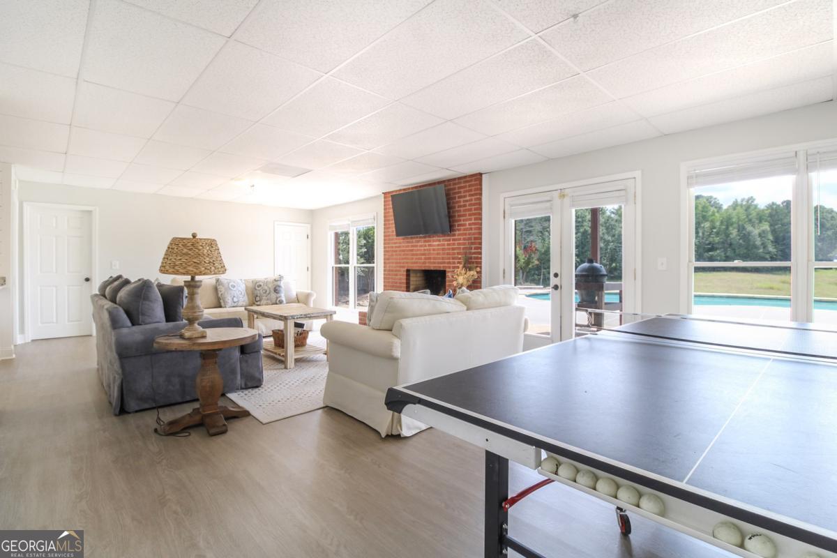 1380 Sunset Ridge Watkinsville, GA 30677 - Photo 31 of 74 a living room with fireplace furniture and a large window
