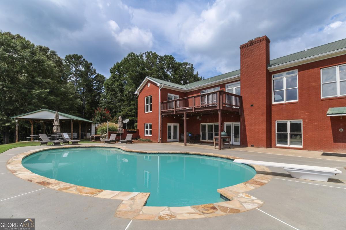 1380 Sunset Ridge Watkinsville, GA 30677 - Photo 50 of 74 a view of a house with a yard and sitting area