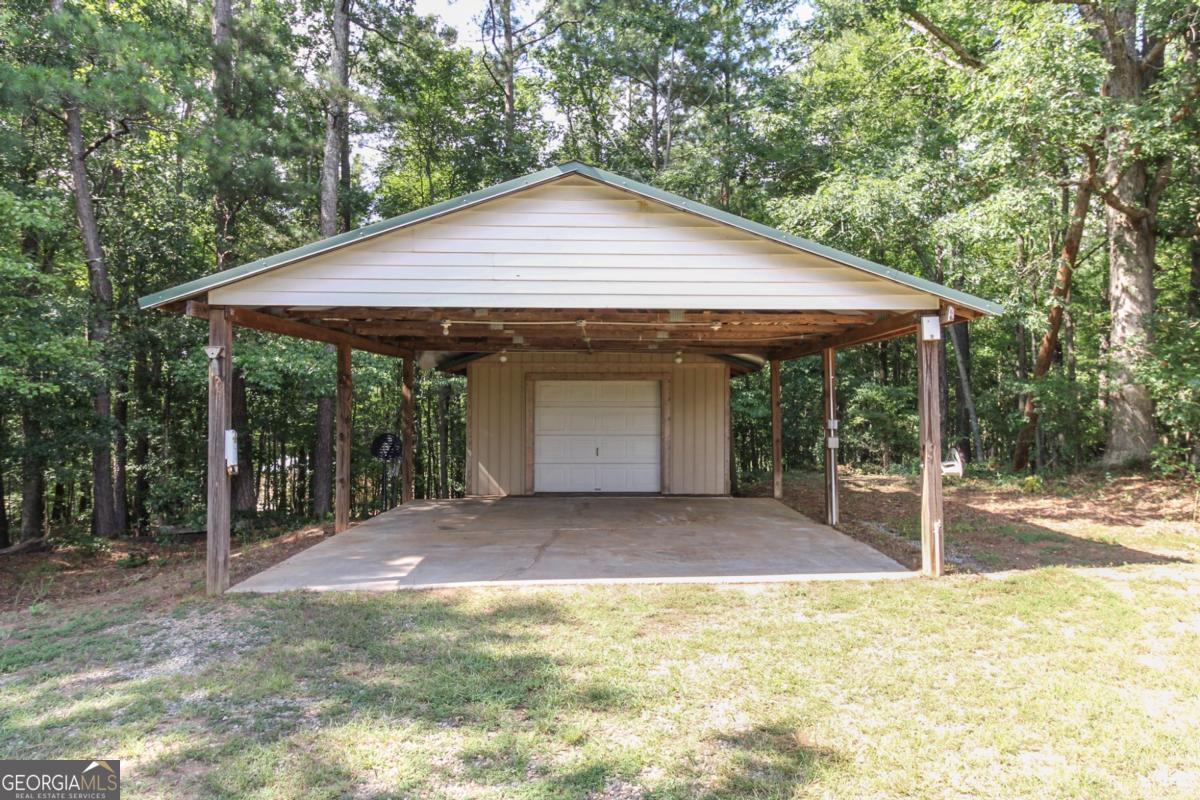 1380 Sunset Ridge Watkinsville, GA 30677 - Photo 56 of 74 a view of a house with backyard and garden