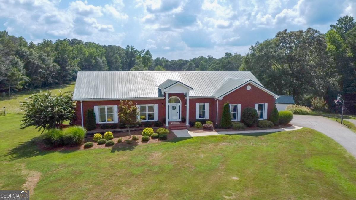 1380 Sunset Ridge Watkinsville, GA 30677 - Photo 61 of 74 a aerial view of a house with a yard patio and fire pit
