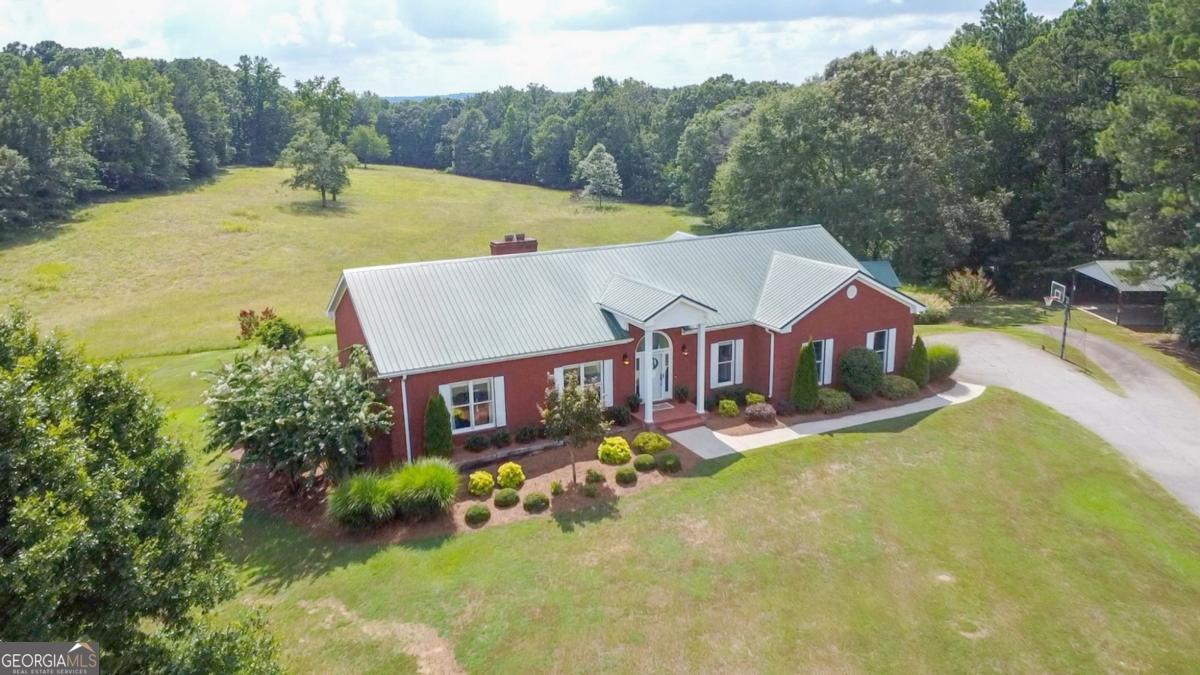 1380 Sunset Ridge Watkinsville, GA 30677 - Photo 62 of 74 a view of a house with pool and a yard