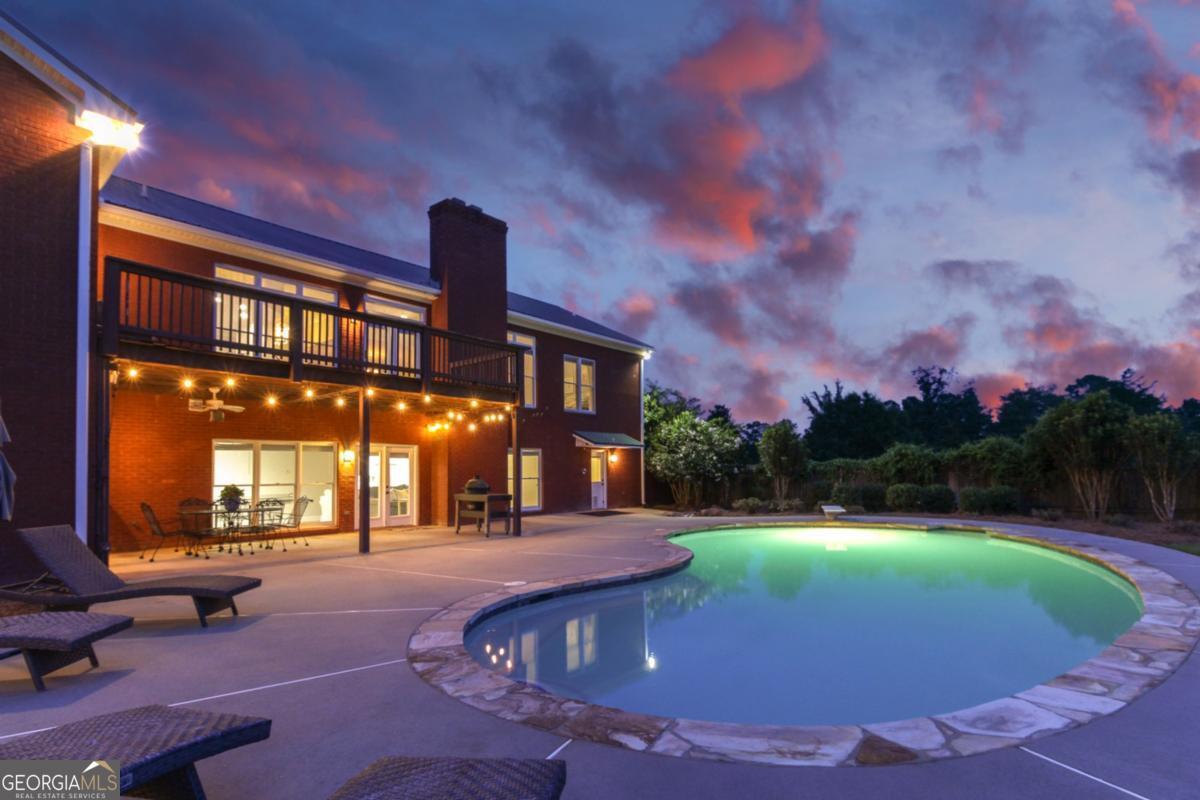 1380 Sunset Ridge Watkinsville, GA 30677 - Photo 65 of 74 a swimming pool with outdoor seating and yard