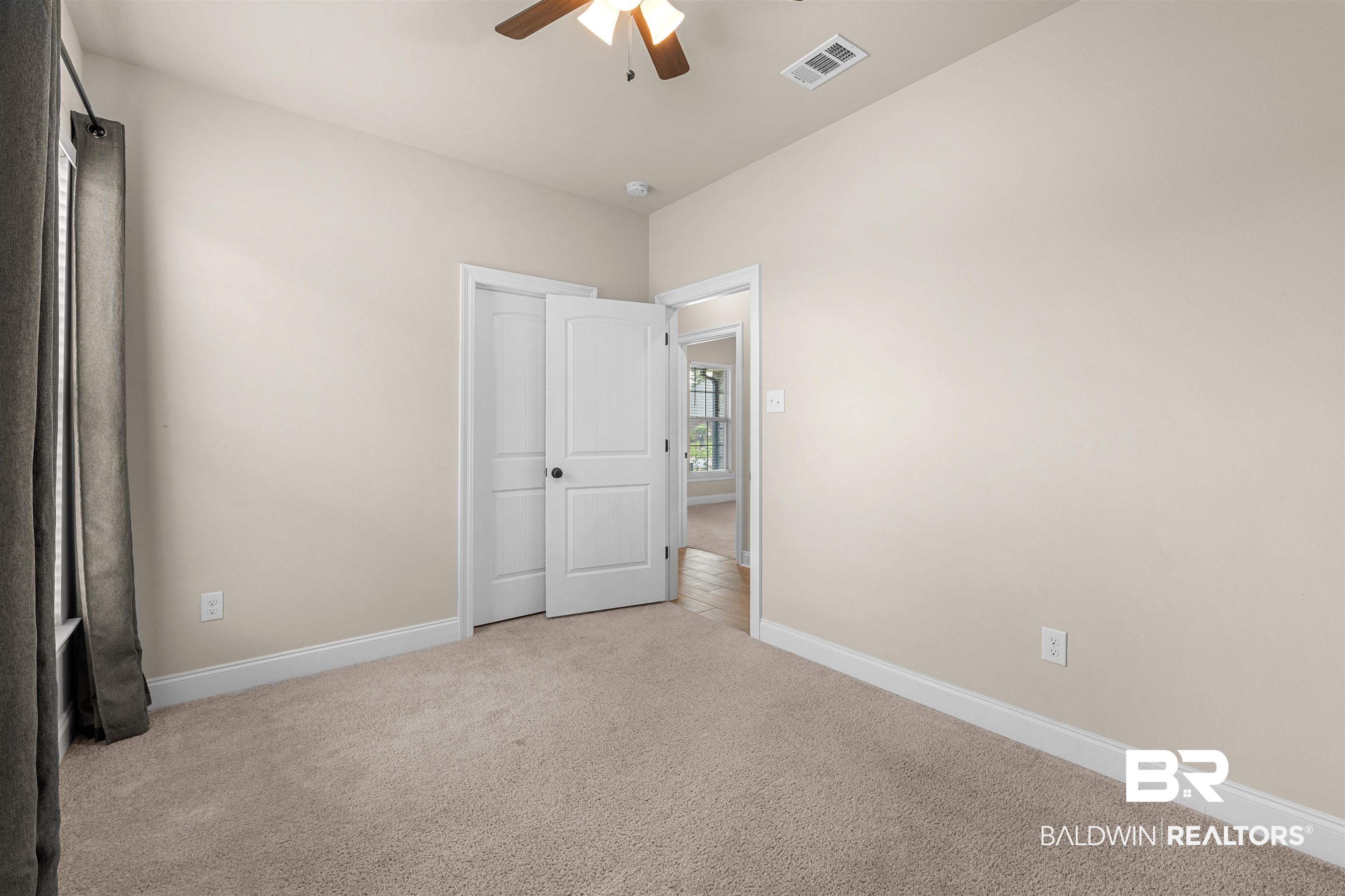991 Dalton Circle Foley, AL 36535 - Photo 15 of 35 Unfurnished bedroom featuring light carpet and a ceiling fan
