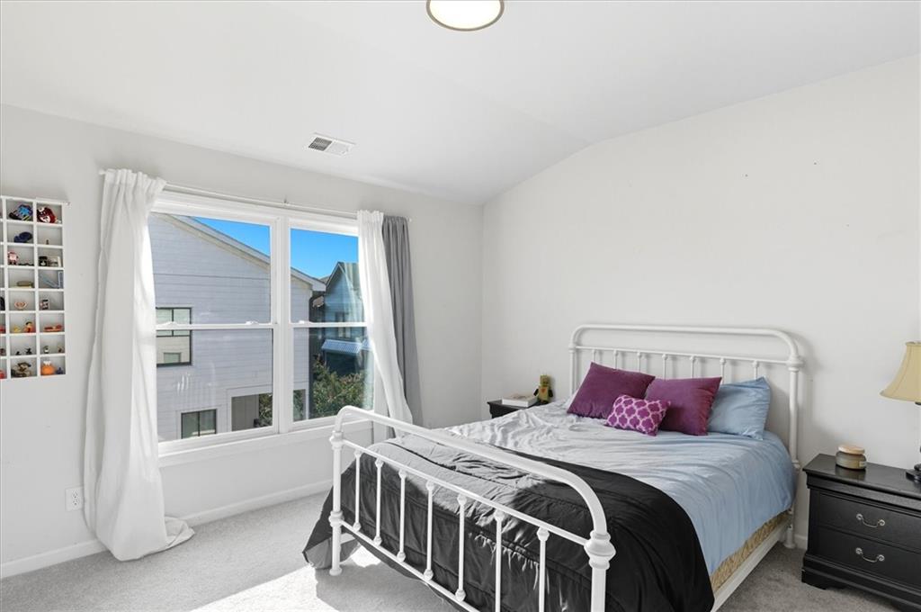 1157 Rambler Cross Atlanta, GA 30312 - Photo 24 of 49 a bedroom with a bed and a window
