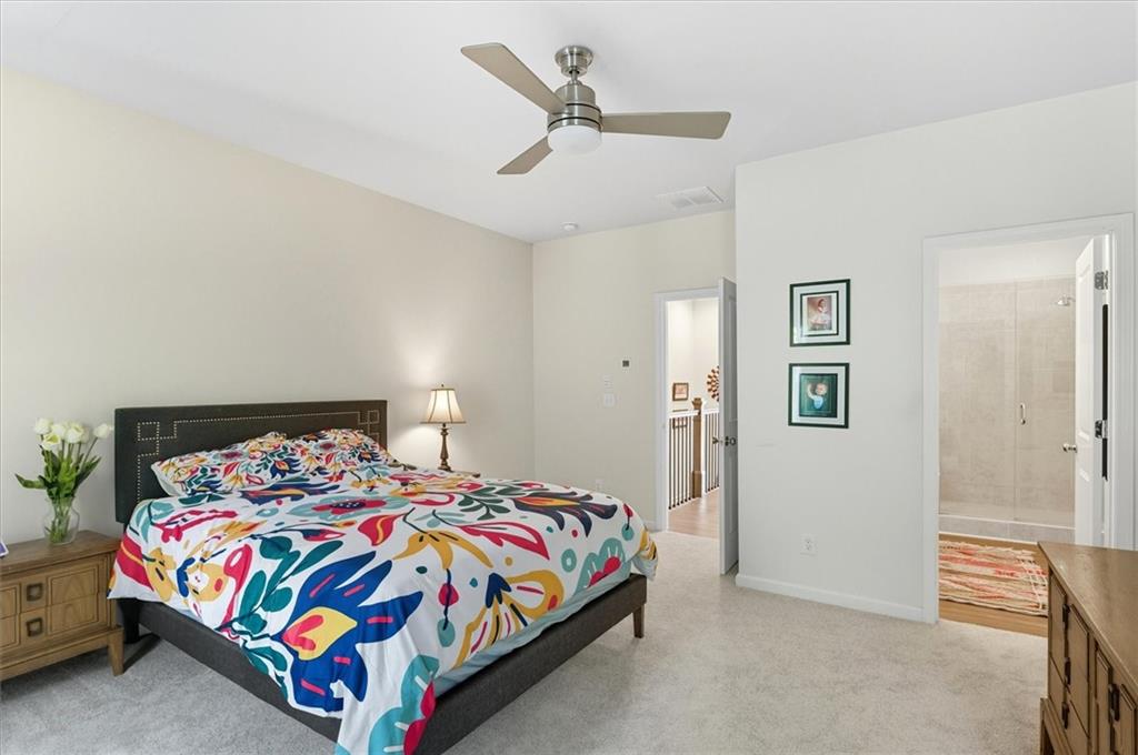 1157 Rambler Cross Atlanta, GA 30312 - Photo 33 of 49 a bedroom with a bed and a chandelier