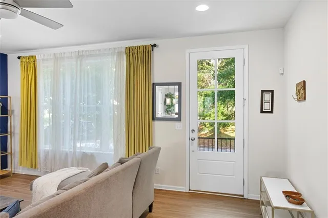 a living room with furniture and a window