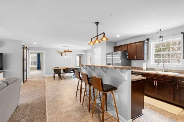 a kitchen with a table and chairs in it