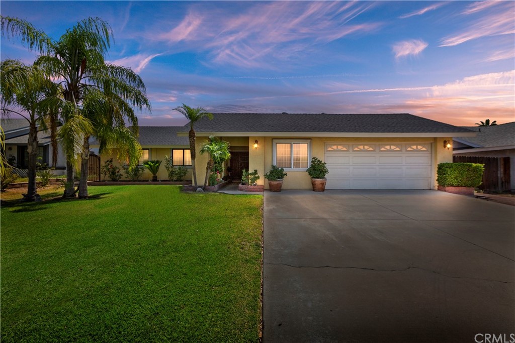 681 Church Avenue Rialto, CA 92316 - Photo 1 of 1 a front view of a house with a yard and a street