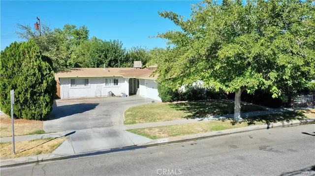 a house with trees in the background