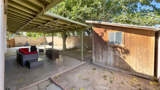a view of patio with table and chairs