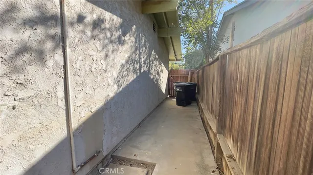 a balcony with trees in front of it
