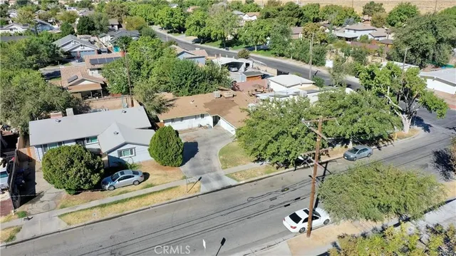 an aerial view of a house with a yard
