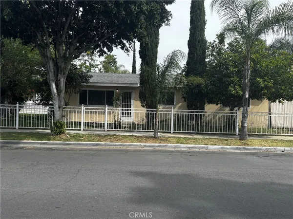 a view of a house with a large trees