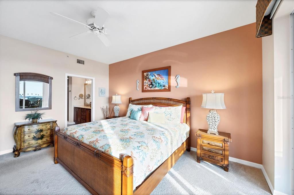 13113 Gasparilla Road, Unit 403 Placida, FL 33946 - Photo 22 of 62 a bed room with a bed and a couch