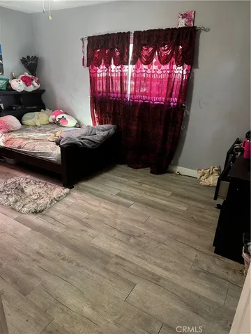 a bathroom with a toilet and a shower curtain