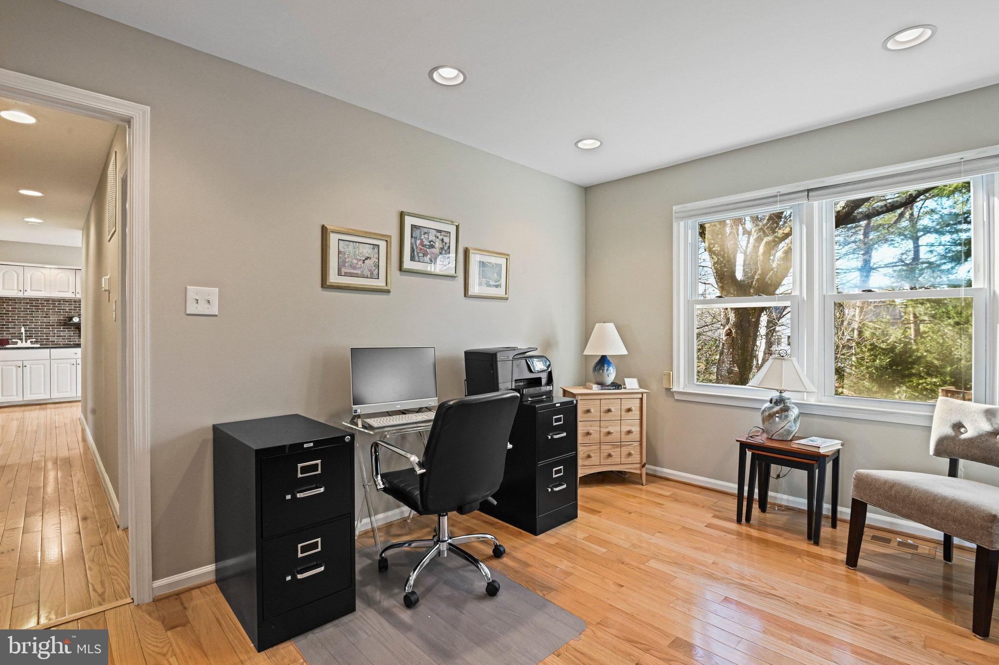 2707 Glencroft Road Vienna, VA 22181 - Photo 13 of 53 a view of a workspace with furniture and a window